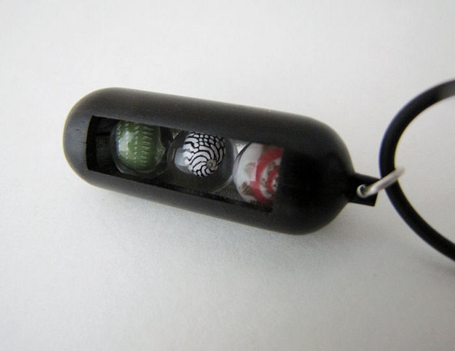 Ebony with Pink Umbonium, Zebra shell and Emerald Nerite spheres : $275